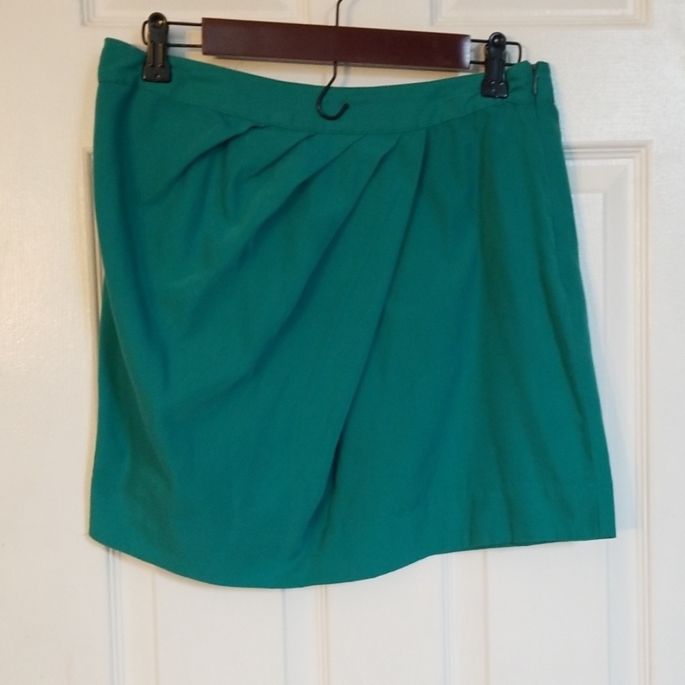Teal skirt with diagonal pleated design